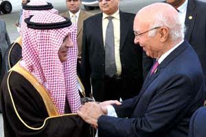 APP50-07 RAWALPINDI: January 07 - Adviser to Prime Minister on Foreign Affairs, Sartaj Aziz receiving Saudi Foreign Minister Adil bin Ahmed Al-Jubeir at Noor Khan Airbase. APP photo by Irshad Sheikh