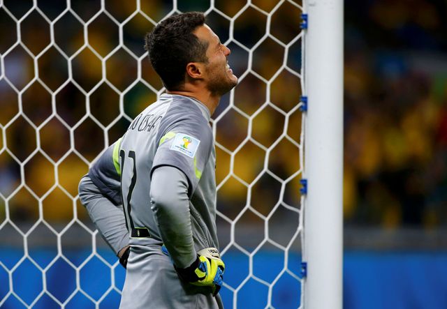 Brazil's goalkeeper Julio Cesar reacts after Germany's Andre Schuerrle (unseen) scores the team's seventh goal during their 2014 World Cup semi-finals at the Mineirao stadium in Belo Horizonte July 8, 2014. REUTERS/Damir Sagolj (BRAZIL - Tags: SOCCER SPORT WORLD CUP)