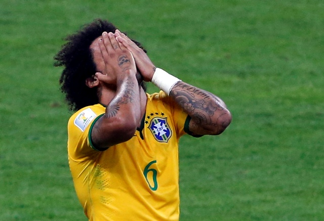 Brazil's Marcelo reacts during their 2014 World Cup semi-finals against Germany at the Mineirao stadium in Belo Horizonte July 8, 2014. REUTERS/David Gray (BRAZIL - Tags: SOCCER SPORT WORLD CUP)