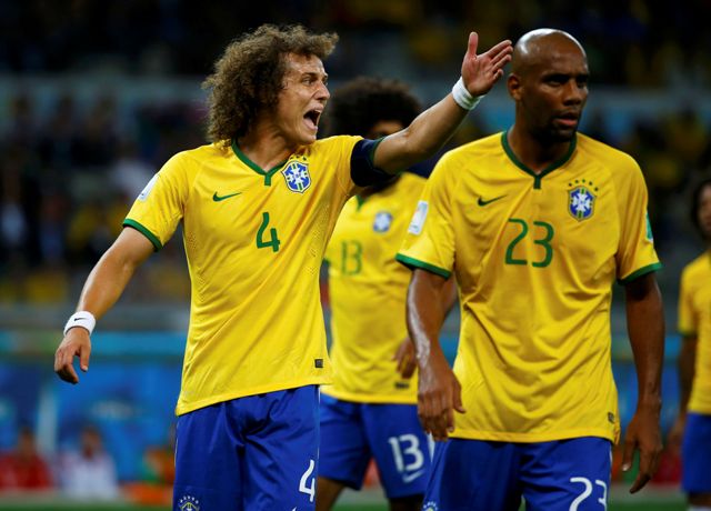 Brazil's David Luiz (L) reacts next to his teammate Maicon during their 2014 World Cup semi-finals against Germany at the Mineirao stadium in Belo Horizonte July 8, 2014. REUTERS/Damir Sagolj (BRAZIL - Tags: SOCCER SPORT WORLD CUP)