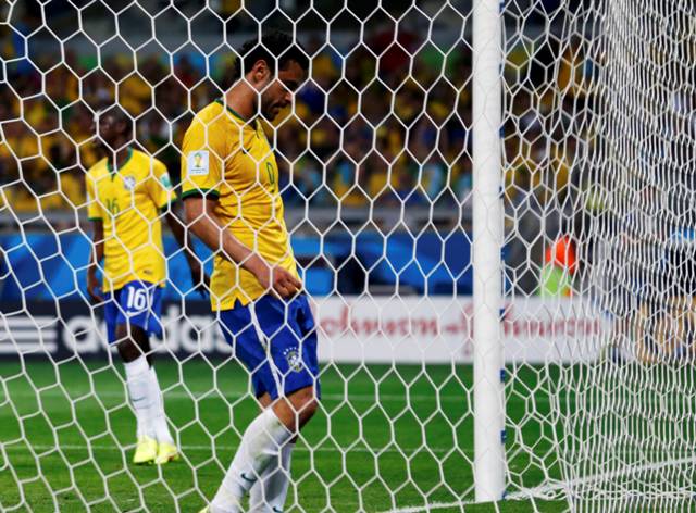 Brazil's Fred reacts after missing a goal scoring opportunity against Germany during their 2014 World Cup semi-finals at the Mineirao stadium in Belo Horizonte July 8, 2014. REUTERS/Marcos Brindicci (BRAZIL - Tags: SOCCER SPORT WORLD CUP)