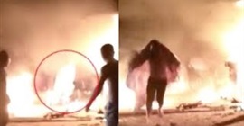 شاهد.. رجل يلقي بنفسه وسط النيران لإنقاذ آخرين