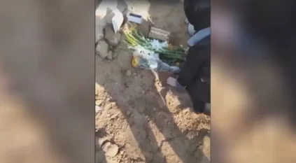 إيرانية تبكي على قبر ابنها عقب إعدامه