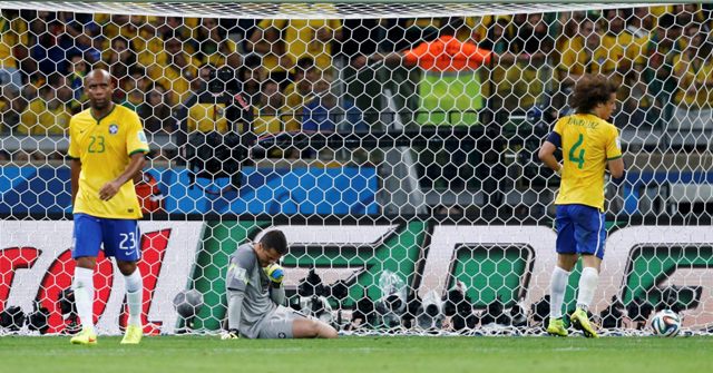 Brazil's players react after conceding their sixth goal against Germany during their 2014 World Cup semi-finals at the Mineirao stadium in Belo Horizonte July 8, 2014. REUTERS/Marcos Brindicci (BRAZIL - Tags: SOCCER SPORT WORLD CUP TPX IMAGES OF THE DAY)