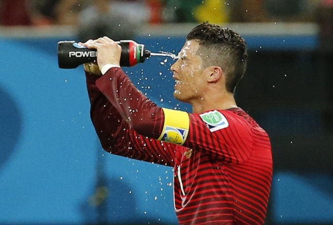 Portugal's Cristiano Ronaldo takes a water break during the 2014 World Cup G soccer match between Portugal and the U.S. at the Amazonia arena