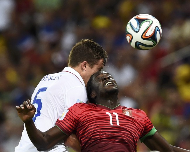 Portugal's Eder fights for the ball with Besler of the U.S. during their 2014 World Cup Group G soccer match at the Amazonia arena in Manaus