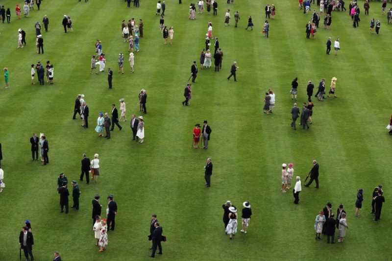 Guests attend a garden party at Buckingham Palace in London, England, on May 24, 2016.