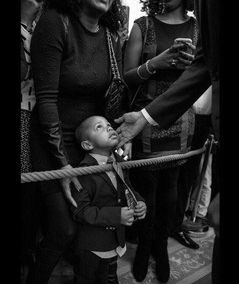 President Barack Obama greets a young guest during a reception celebrating african american history month in the east room of the white house, on Feb. 18, 2016.