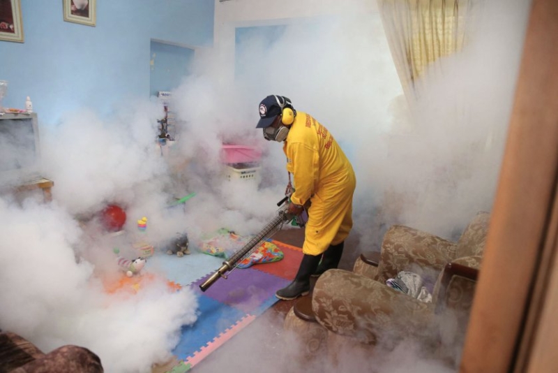 An employee conducts fumigation to prevent the Zika virus in the Carabayllo District, Lima Province, Peru, on Jan. 29, 2016. The Health Ministry of Peru held fumigation campaigns to prevent the spreading Zika virus, according to local press.
