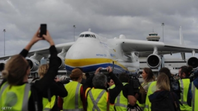 Members of the media (below) take part in a press conference in front of the world's largest aircraft, the Ukraine-built Antonov An-225 Mriya, after it touched down at Perth Airport on May 15, 2016. The six-engine aircraft, built to transport the Soviet space shuttle the Buran, is now used for cargo no other plane can handle and on this flight to Perth it carried a large generator purchased by a Western Australian resources company. / AFP / Greg Wood        (Photo credit should read GREG WOOD/AFP/Getty Images)