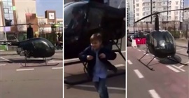 شاهد.. أب ينقل ابنه للمدرسة بالهليكوبتر!