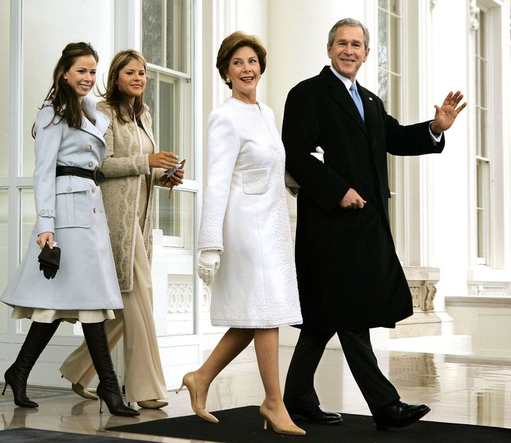 President George W. Bush and first lady Laura Bush depart the North Portico of the White House for the limousine ride to the Capitol where he will take the Oath of Office and begin his second term, in Washington, Thursday, Jan. 20, 2005. They are joined by their daughters Barbara, far left, and Jenna. (AP Photo/J. Scott Applewhite)