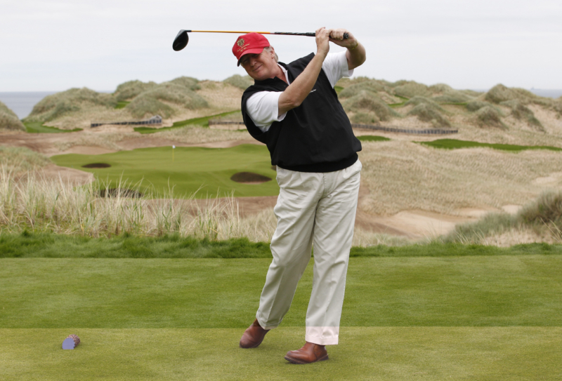 U.S. property magnate Donald Trump practices his swing at the 13th tee of his new Trump International Golf Links course on the Menie Estate near Aberdeen, north east Scotland June 20, 2011. Trump was in Scotland to give a media tour of the luxury golf course a year into its construction. REUTERS/David Moir (BRITAIN - Tags: BUSINESS SPORT GOLF SOCIETY) - RTR2NVWU