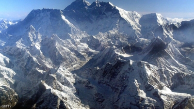 EVEREST HIMALAYAN RANGE, NEPAL - MAY 18: Mount Everest is shown at approximately 8,850-meter (29,035-foot) May 18, 2003 in Nepal. The world's tallest mountain is (back-center) surrounded by Nuptse (R) 8848m and Lhotse, 8576m (L). A record 1,000 climbers plan assaults on the summit as mountaineers celebrate the 50-year anniversary of the conquest of Everest on May 29. (Photo by Paula Bronstein/Getty Images)