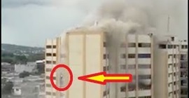 شاهد.. رجل ينجو بأعجوبة من حريق بالقفز من مبنى شاهق