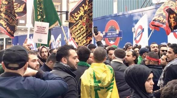 بريطانيا تحقق في رفع أعلام حزب الله في مسيرة عاشوراء