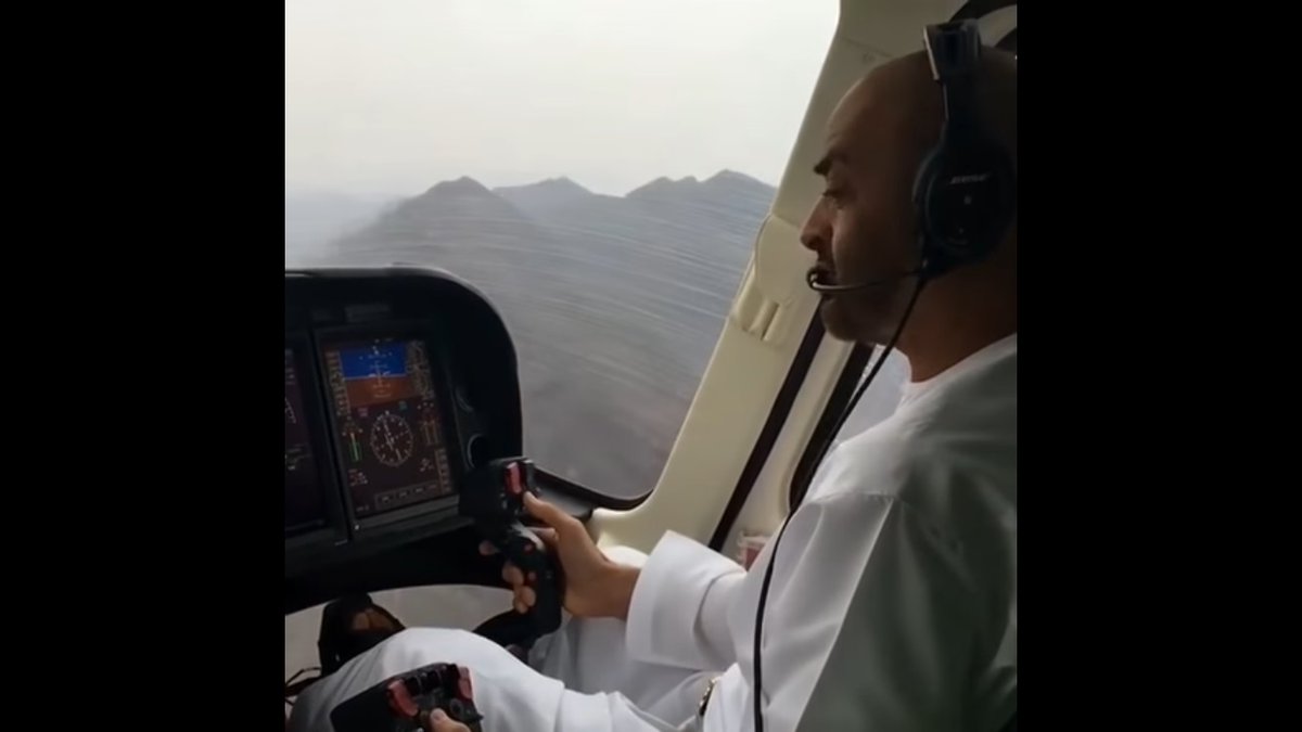 شاهد.. محمد بن زايد يقود مروحية فوق جبال الإمارات