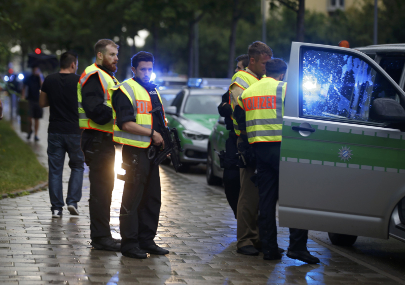 Police secure a street near to the scene of a shooting in Munich, Germany July 22, 2016. REUTERS/Michael Dalder